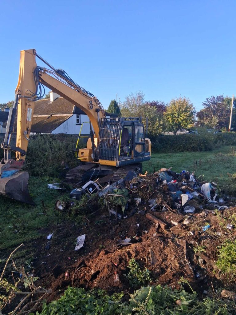 digger clearing rubbish