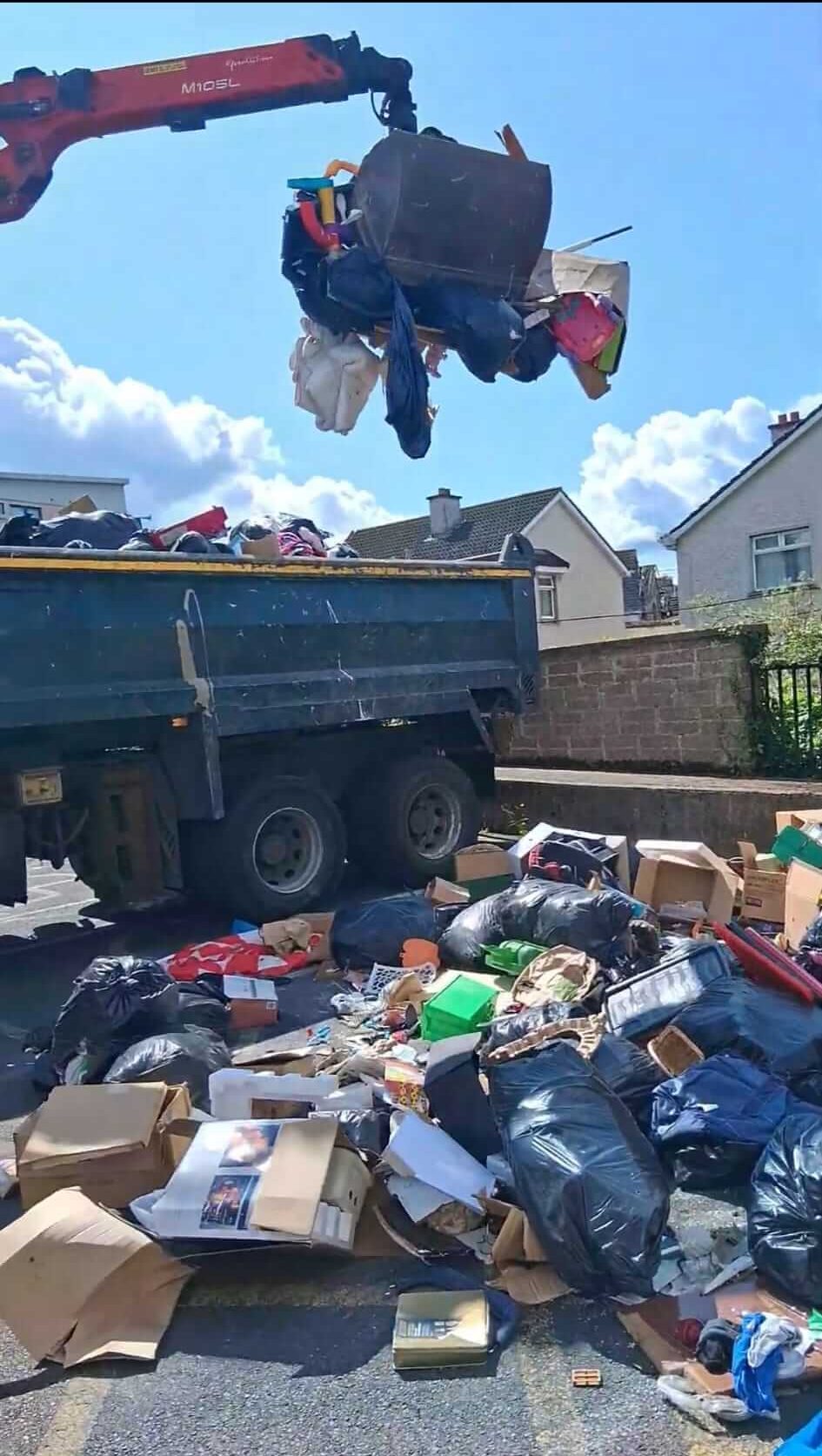 grab machine picking up rubbish